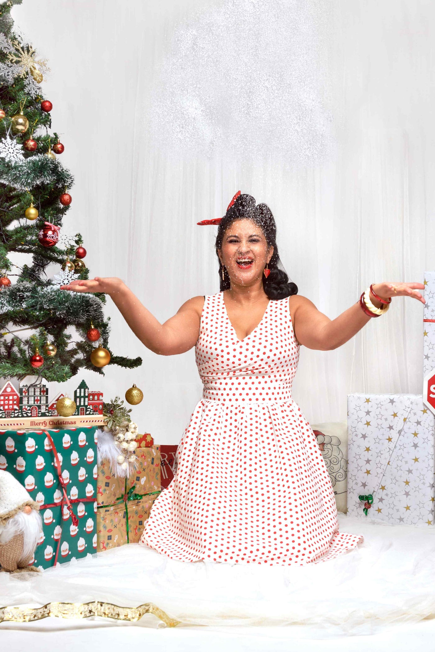 A model wearing V Neck White and Red Polka Dot Dress