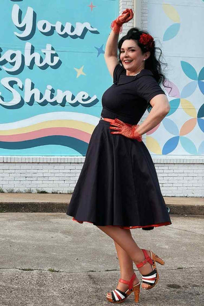 A lady wearing a Navy Blue Roll Collar Circle Dress