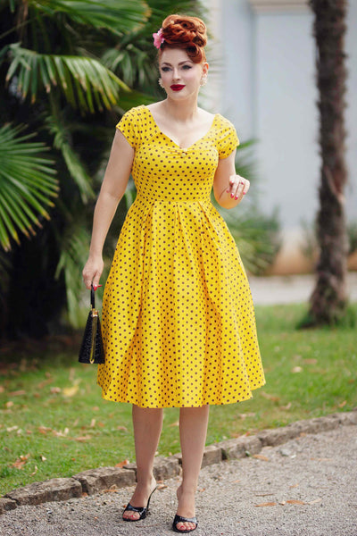 A model wearing a Yellow Polka Dot Off Shoulder Dress