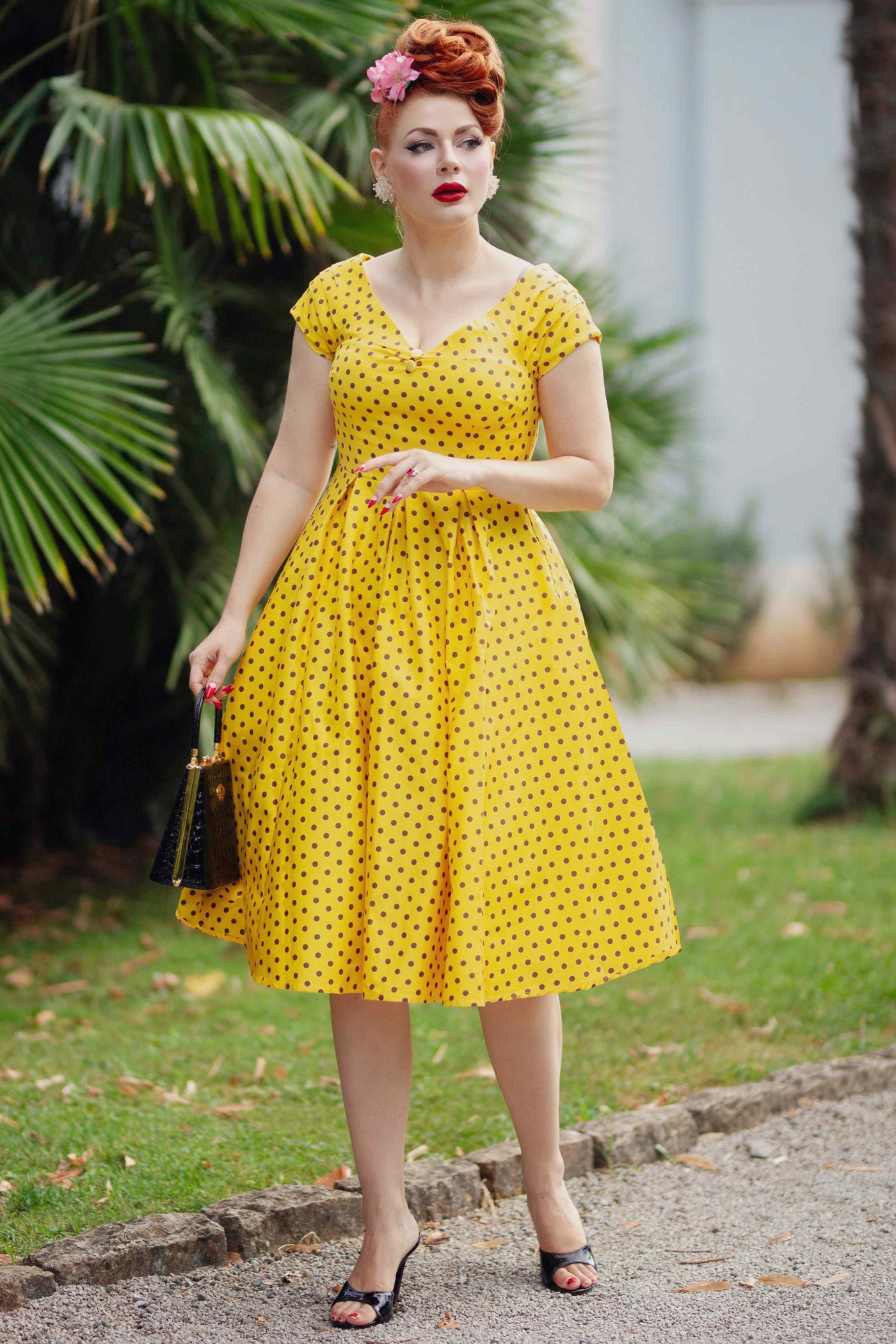 A model wearing a Yellow Polka Dot Off Shoulder Dress