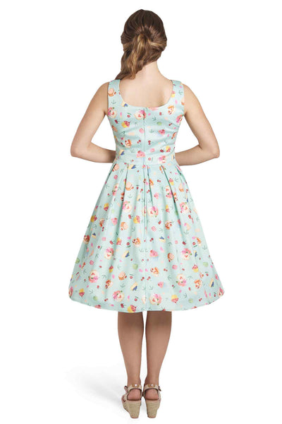 Model wearing 50's Afternoon Tea Dress In Blue Cake Print