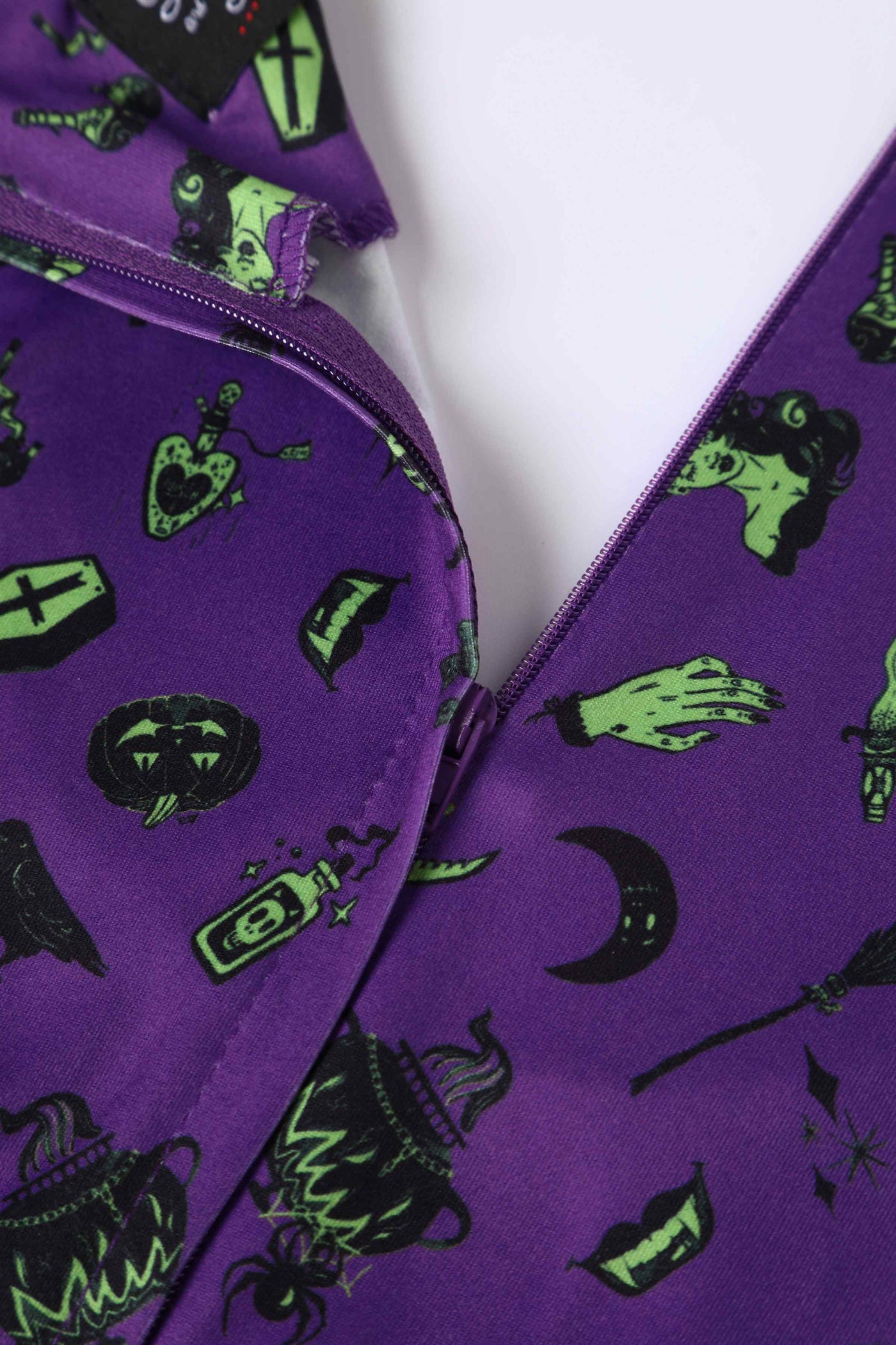 Close up View of Wizard and Witch Long Sleeved Swing Dress in Purple