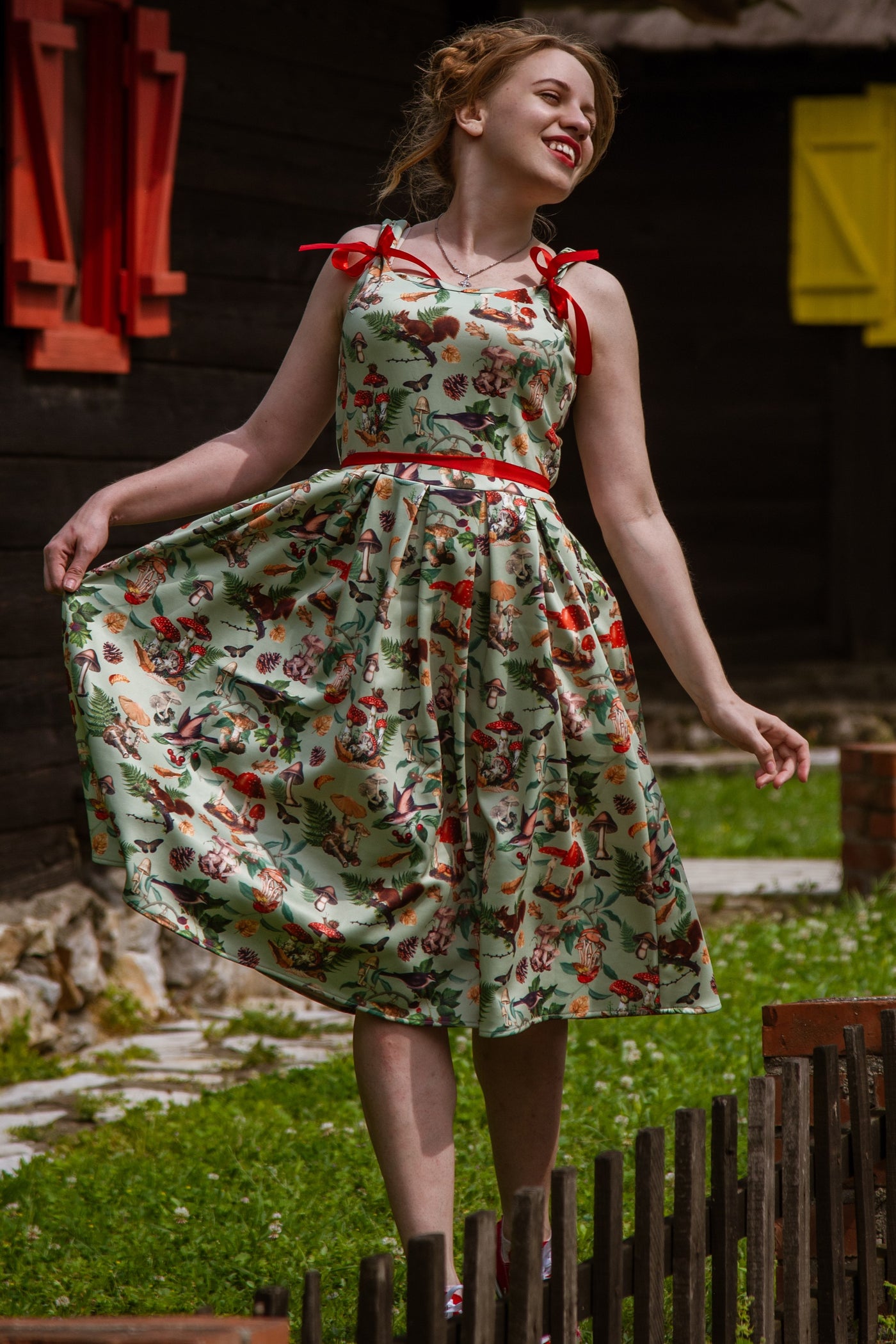 A model wearing a Woodland Flared Dress In Tea Green