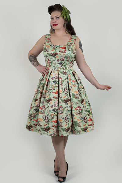 A model wearing a Woodland Flared Dress In Tea Green