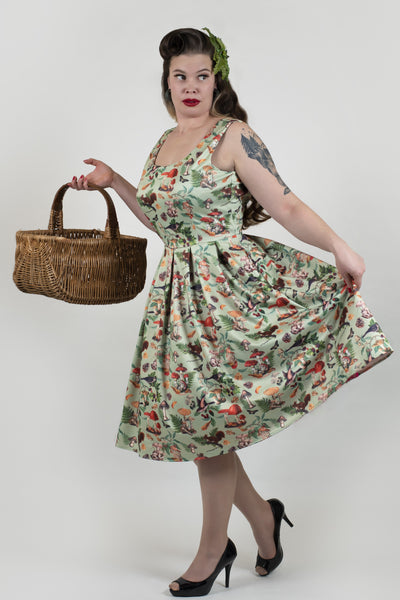 A model wearing a Woodland Flared Dress In Tea Green