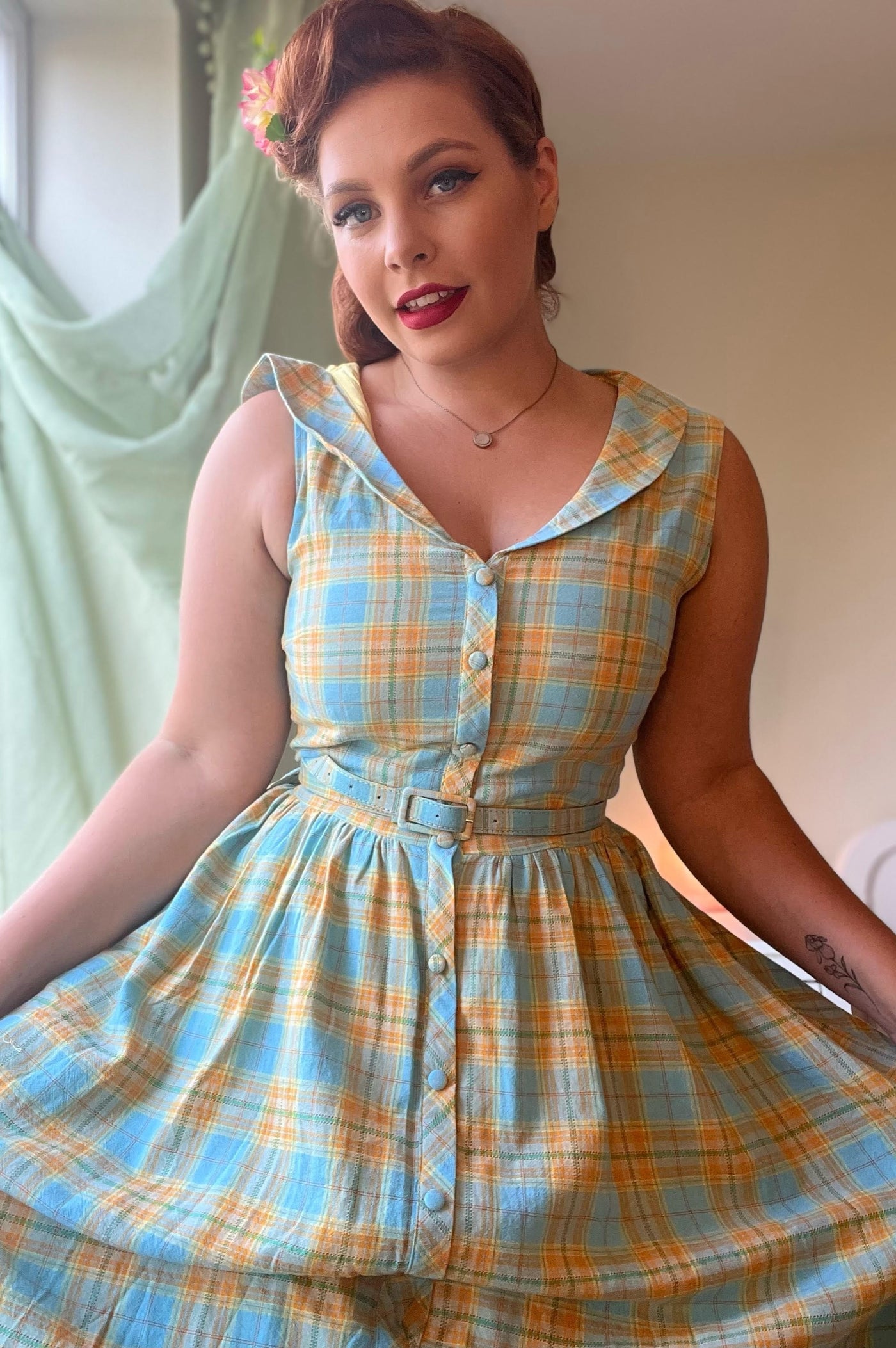 Woman wearing yellow and blue check shirt dress