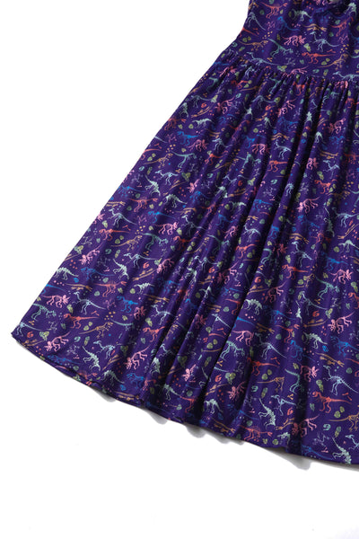 Close up view of Dinosaur Fossil Print Dress in Purple